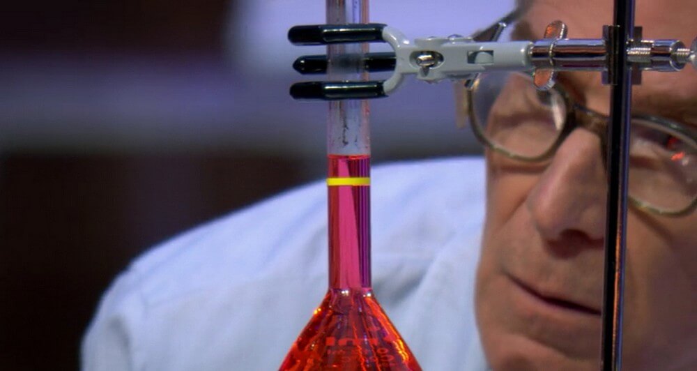 Screenshot featuring closeup of Bill Nye looking at a heated fluid