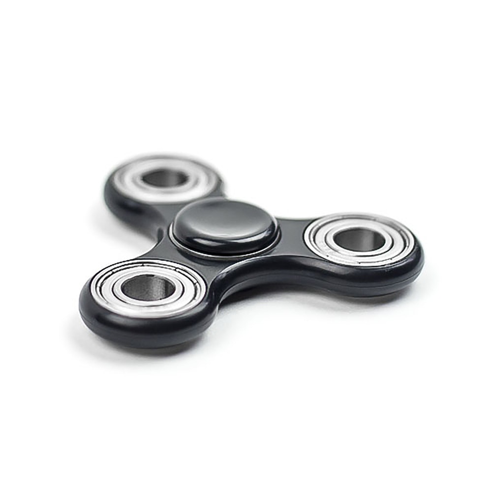 Photo of a fidget spinner on a white background/surface