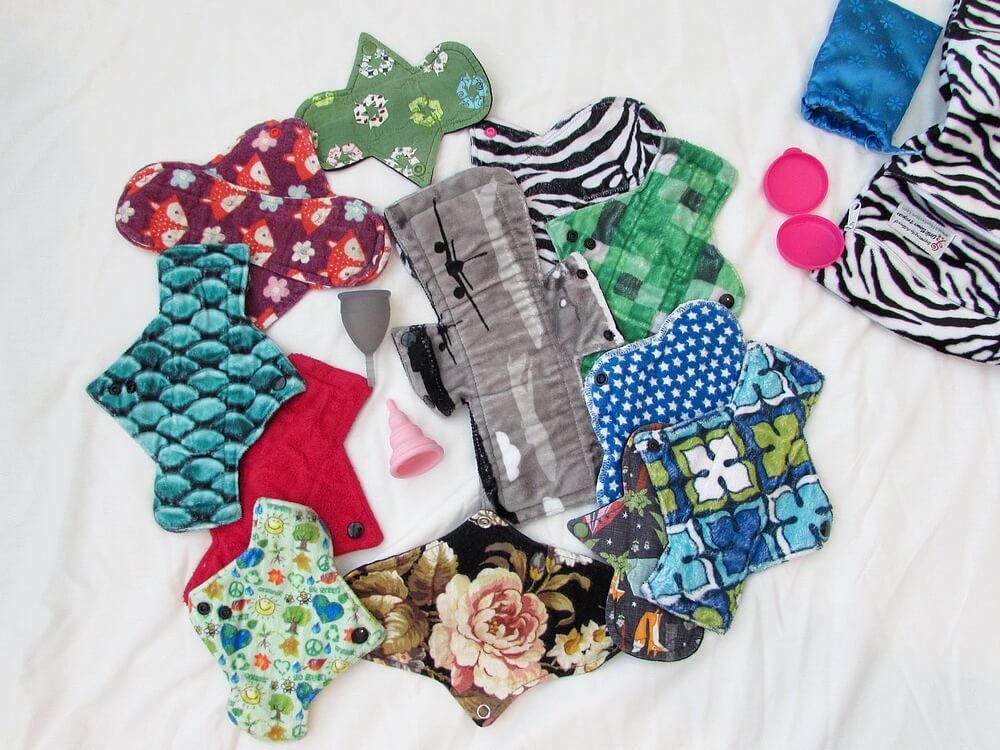 Pile of cloth pads and menstrual cups
