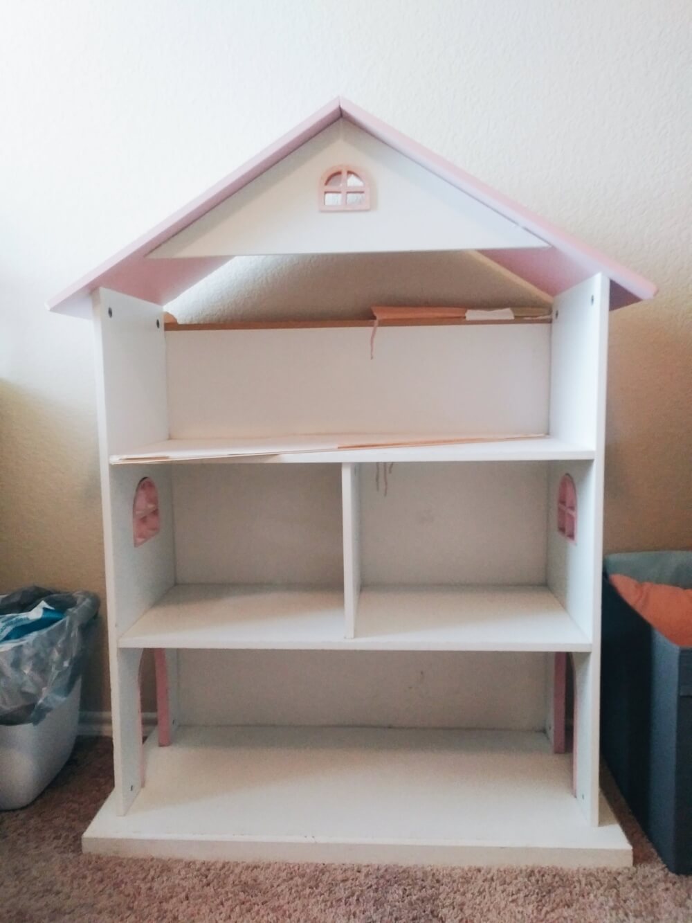 Pink and white dollhouse