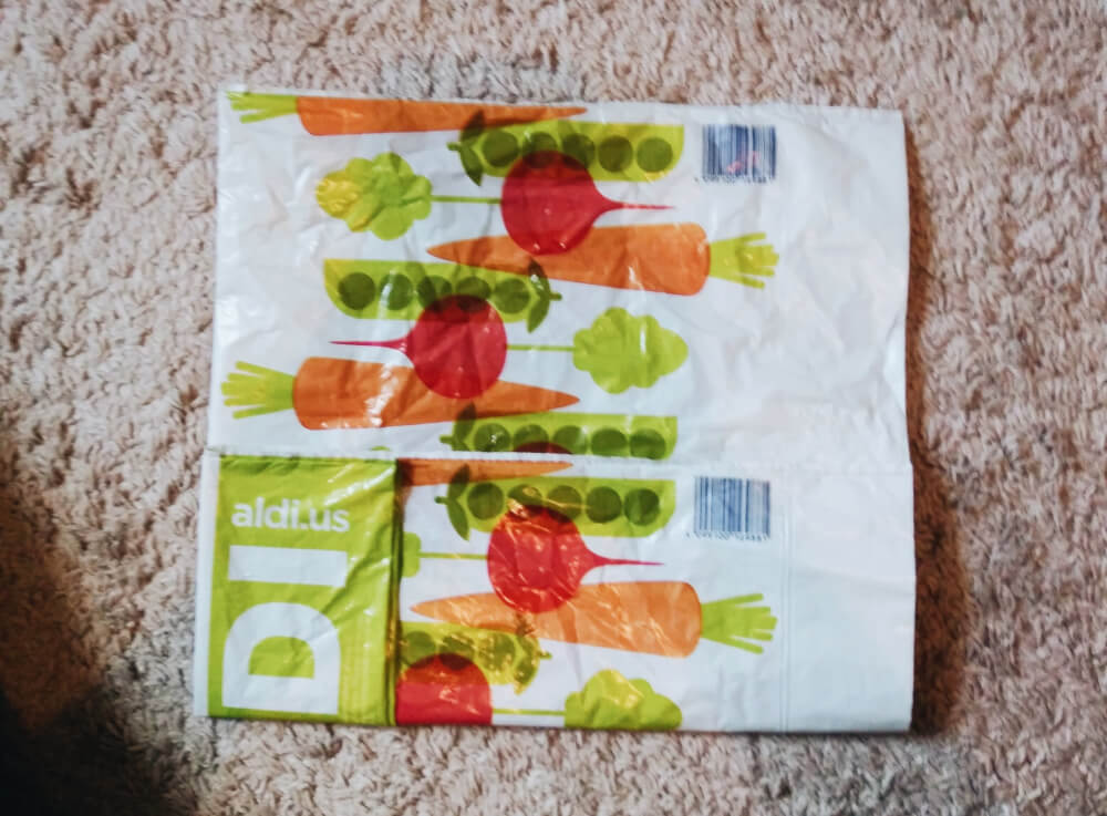 Folding Aldi grocery bag into thirds