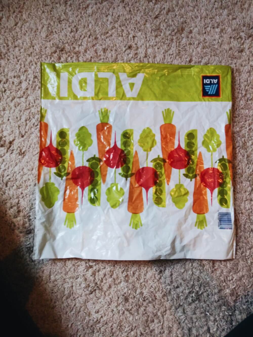 Flat Aldi grocery bag, upside down, with handles tucked in