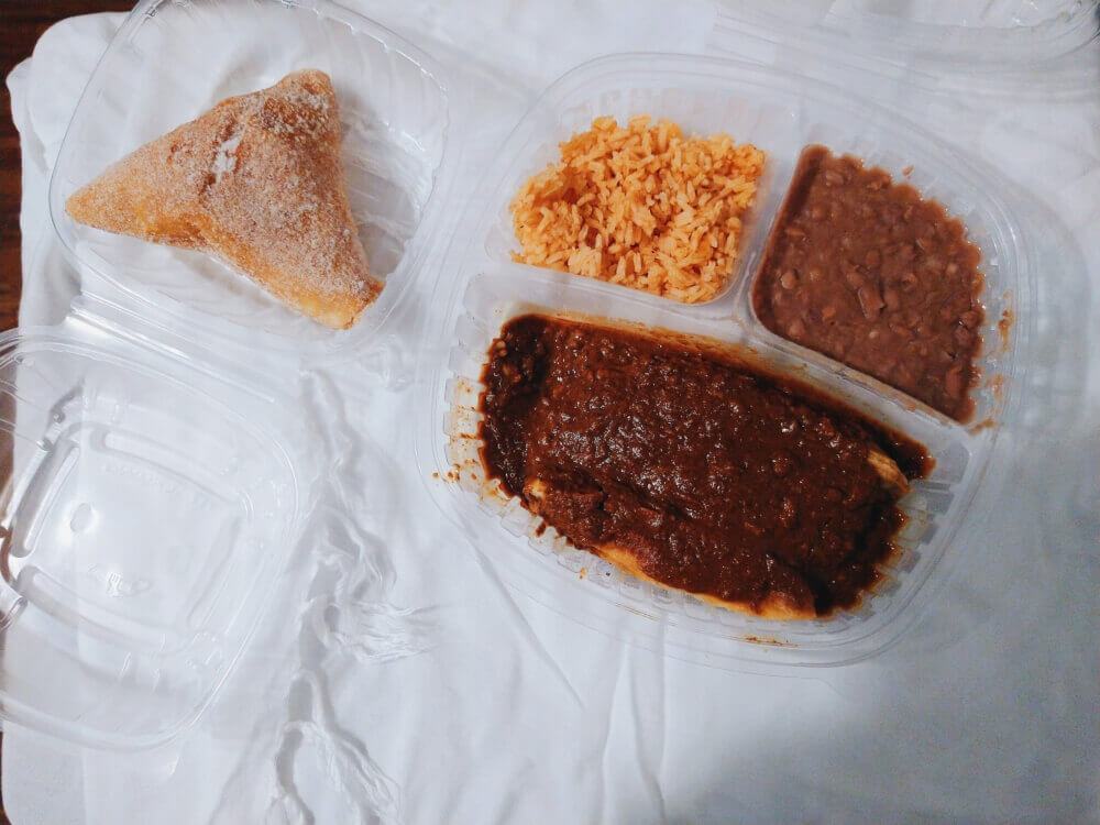Chili con carne beef tamales, rice, beans, sopapilla